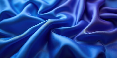 Fototapeta premium Vibrant deep blue satin fabric glistens with smooth, glossy texture; intricate folds and creases evoke dynamic movement in every detail