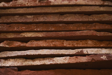 closeup stacked old brick cut tiles