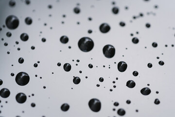 Closeup rain drops on glass with hydrophobic coating