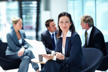Portrait, meeting or businesswoman with documents or legal team for court case, research or support. Confident, paperwork or lawyers in office with attorney or advisor at law firm for feedback review