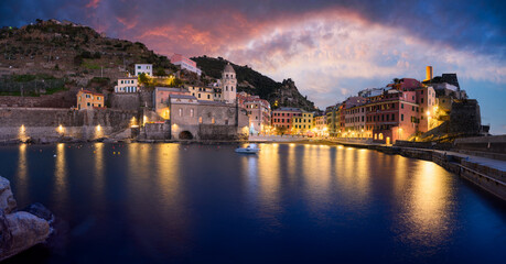 Evening view on fishing village Vernazza with multicolored houses and sunset sky. Cinque Terre National park, Liguria, Italy. Landscape photography