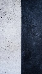 Fototapeta premium A stark contrast: a wall divided in two, one half white, the other dark.