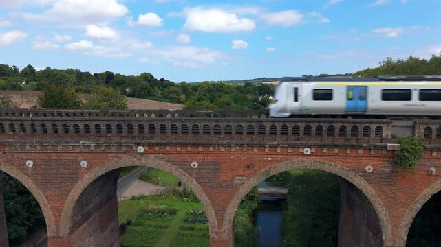 Train crossing Eynsford Viaduct in Kent, England, aerial view