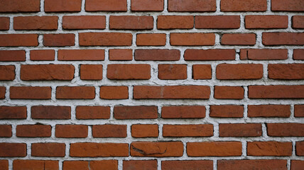 Fototapeta premium Detailed Image of Aged Red Brick Wall Texture for Outdoor and Indoor Building Projects