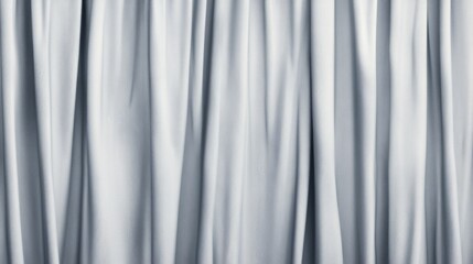 Obraz premium Close-up of elegant, flowing, light gray fabric drapes.
