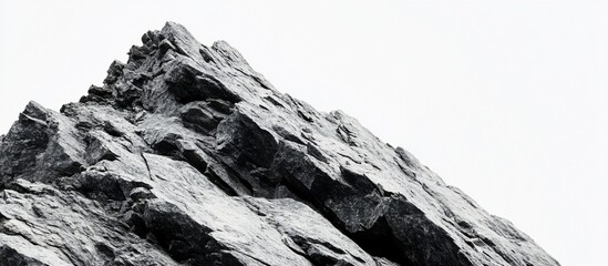 Monochrome mountain peak, rocky texture, clear sky background, website banner