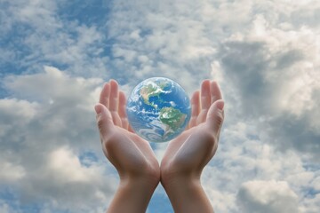 Cupped hands holding globe merging into cloudy sky, symbolizing responsibility