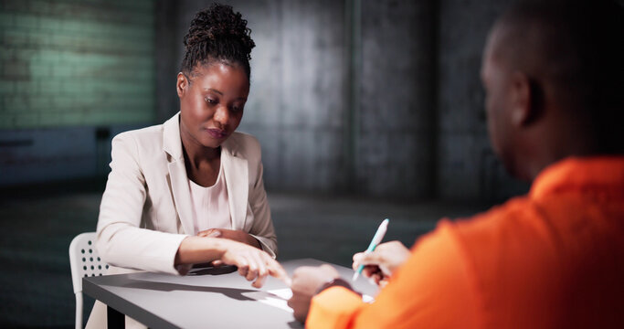 Man Signing Plea Of Guilty In Prison. Police Investigator