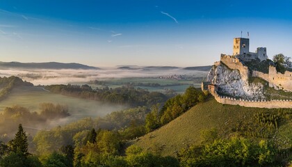 Fototapeta premium Sunrise paints the castle in golden hues. 