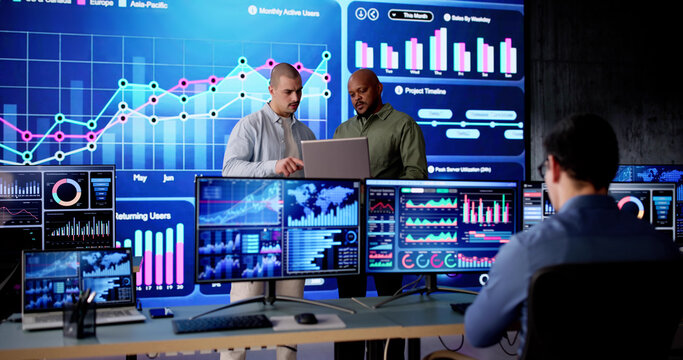 Data center analyst monitors server control - Powered by Adobe