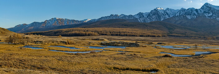 Russia. The South of Western Siberia, the Altai Mountains. View of the swampy flowing labyrinths of Lake Dzhangyskol, lost in the Kurai steppe at the foot of the North Chuisky range.
