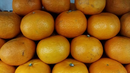 Stacked oranges at the market