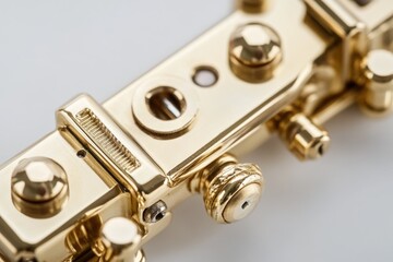 A close-up shot of a shiny gold metal object with intricate details