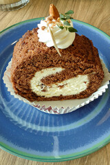 Tiramisu Roll Cake served on a blue plate