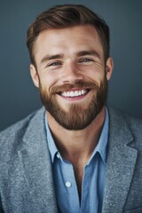 Fototapeta premium A person with a beard smiling for the camera, a friendly and approachable expression
