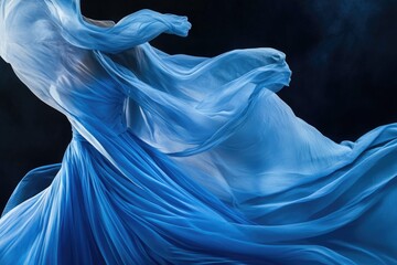 Naklejka premium A woman wearing a blue dress dances in a dynamic pose