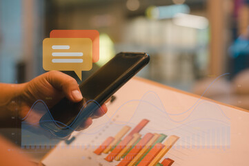 online trading and Social Media Man analysing data chart and using smartphone typing on application communication digital web and social network concept. Social media application chat box