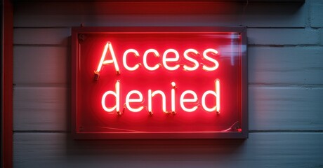 Obraz premium Glowing neon sign with vibrant red outline displaying Access Denied in illuminated letters mounted on dark background symbolizing restriction, prohibition, security, and limitation