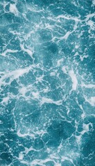 Fototapeta premium Ocean water with whitecaps and foam. A close-up view of the texture.