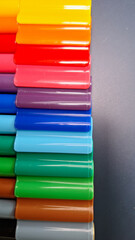Multicolored Felt-Tip Pens isolated on a navy table background. Colorful markers pens.