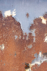 Peeling paint and rust on metal plate