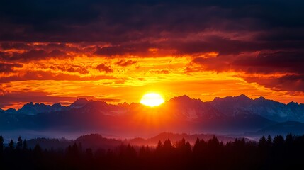 Fototapeta premium Fiery Sunset over Silhouetted Mountains