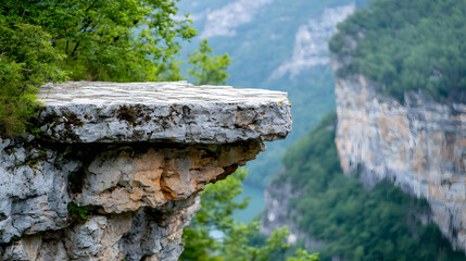 Clifftop rock overlooking canyon, green trees, summer. Landscapes