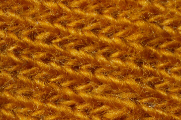 Macro Texture of machine knitting Fabric orange color.