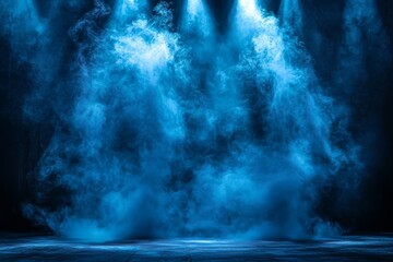 Dramatic blue fog envelops stage lighting during a performance in a theater setting