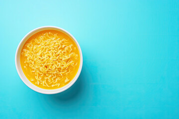 Vibrant Bowl of Noodle Soup with Fresh Vegetables on a Colorful Abstract Background