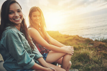 Travel, sunset and portrait with friends at beach for explore, bonding and summer vacation. Happy, calm and peace with women and ocean for holiday destination, adventure and lens flare view together