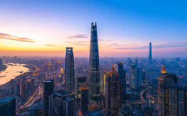 Fototapeta premium Colorful twilight sky over the financial districts modern skyline.
