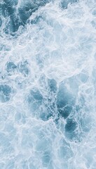 Ocean water churned into frothy whitecaps.