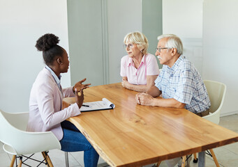 Happy senior old family couple clients make financial insurance estate business deal contract...