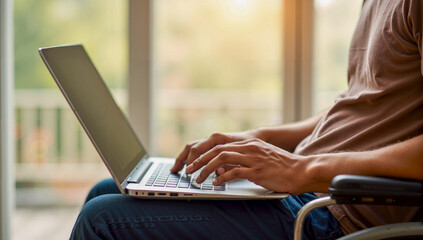 Person Sitting on a Chair Using a Laptop Computer