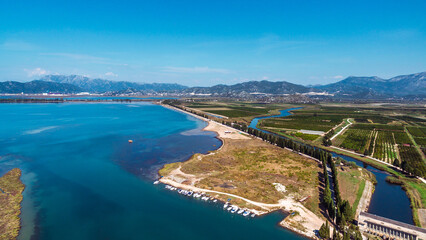 Naklejka premium Stunning Aerial View of Neretva River Estuary and Valley, Southern Croatia. Serene Wetlands, Scenic Landscapes