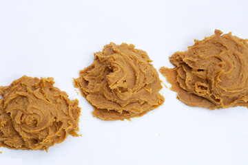 Japanese miso paste on white background.