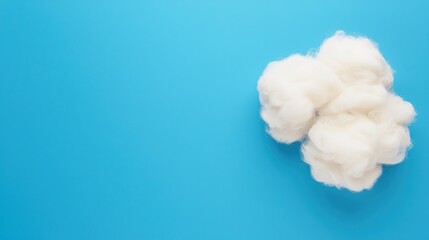 Fluffy white plush on blue background textile art close-up