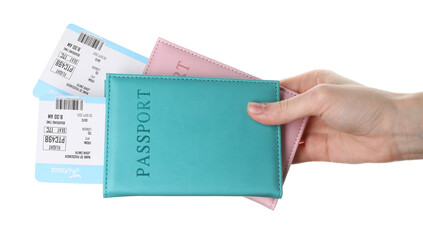 Travel agency. Woman holding flight tickets and passports on white background, closeup