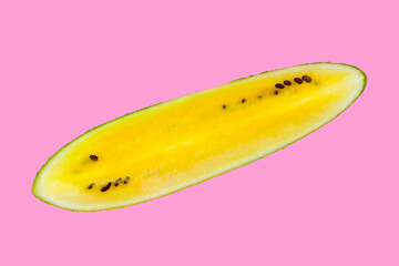 Yellow watermelon slices on pink background.