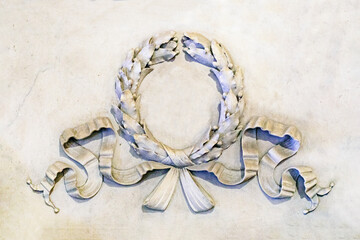 relief vignette with bay leaf from marble on the surface