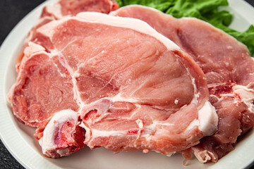 Pork on bones raw meat fresh tasty food dish delicious gourmet food background on the table rustic food top view copy space