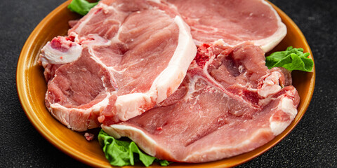 Pork on bones raw meat fresh tasty food dish delicious gourmet food background on the table rustic food top view copy space