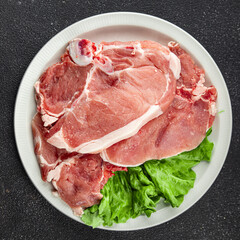 Pork on bones raw meat fresh tasty food dish delicious gourmet food background on the table rustic food top view copy space