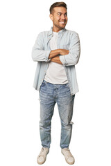 Naklejka premium Full body portrait of a man in studio smiling confident with crossed arms.