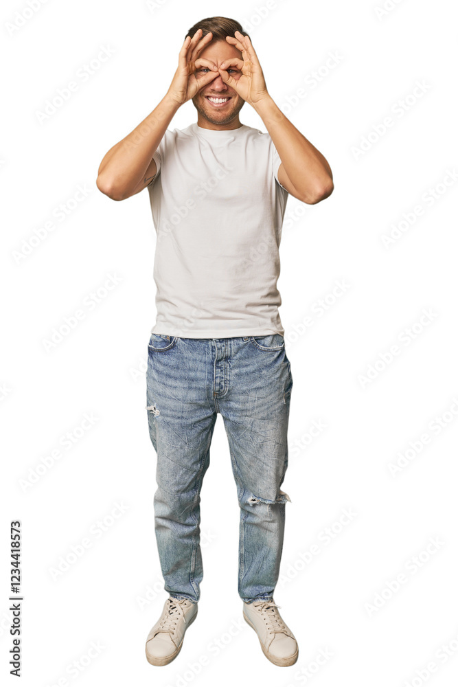 Poster Full body portrait of a man in studio showing okay sign over eyes