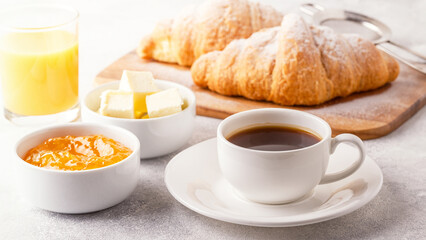 Continental breakfast with fresh croissants, orange juice and coffee