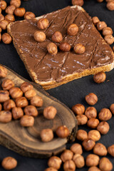 Fototapeta premium hazelnuts and bread with nut paste with chocolate