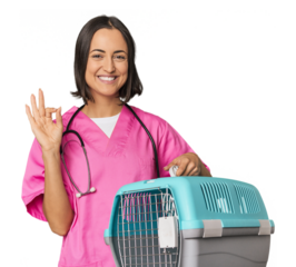 Young Caucasian female vet holding cage cheerful and confident showing ok gesture.