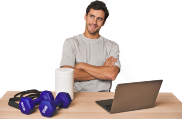 Hispanic trainer planning workout smiling confident with crossed arms.